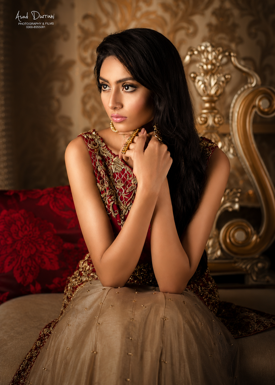 Formal portrait in red and gold embroidered outfit